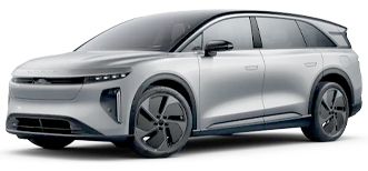 Silver electric SUV with black roof and wheels.