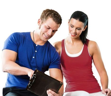 A man and a woman are looking at a clipboard together A man and a woman are looking at a clipboard together