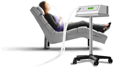 A woman is laying on a bed getting an x-ray from a doctor. A woman is laying on a bed getting an x-ray from a doctor.