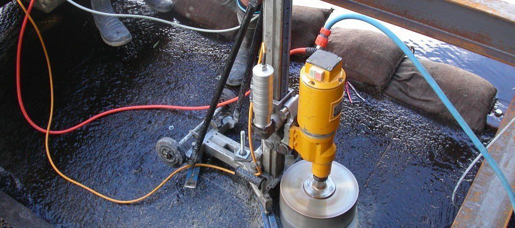 A machine is being used to cut a hole in the ground.