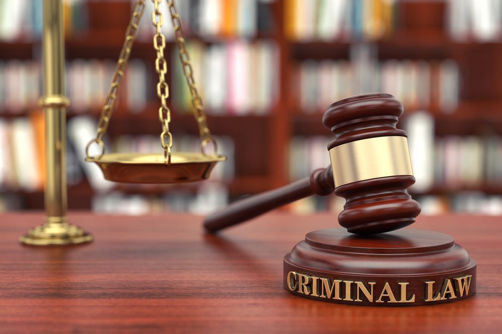 Gavel and scales of justice on a wooden desk with 