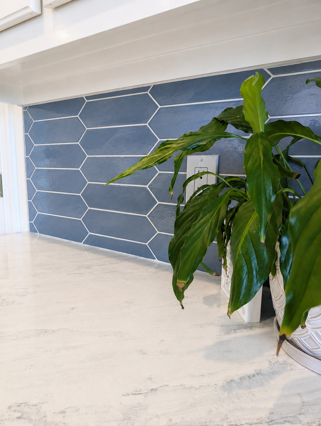 Homeowner and designer reviewing tile samples and material swatches