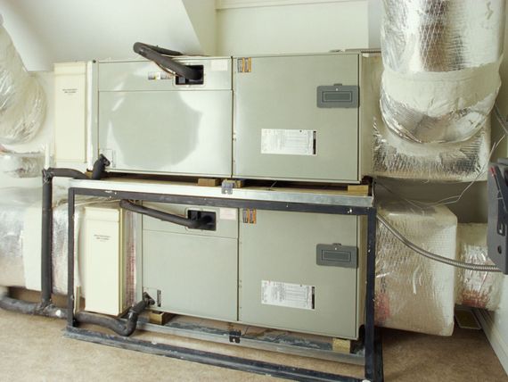 A room with a lot of electrical boxes and ducts