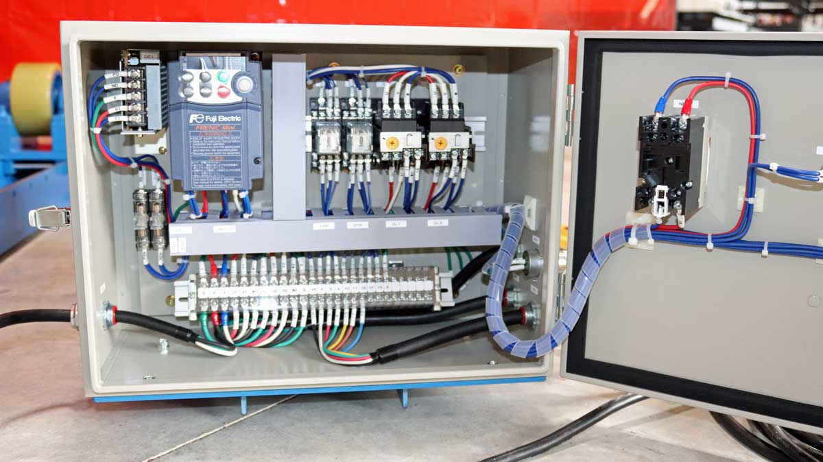 RD-3-INW Tank Turning Roll Electrical Bo The inside of a electrical box with a lot of wires coming out of it.