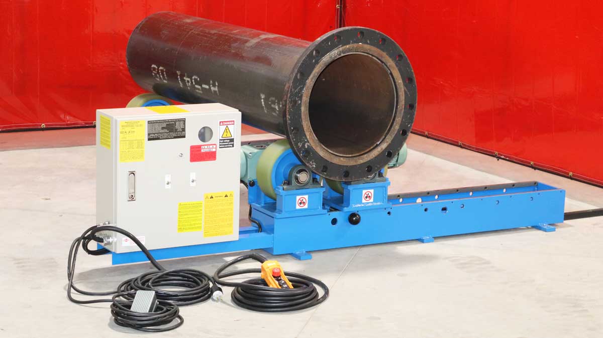 A large pipe is sitting on top of a machine.