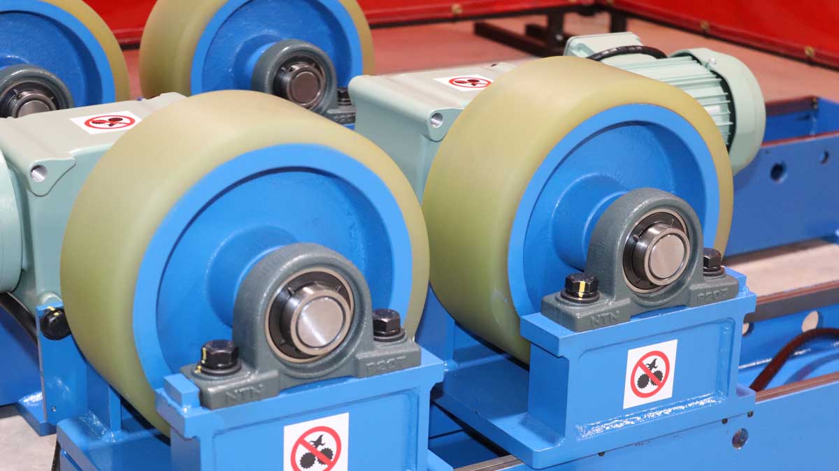 A close up of a machine with wheels on it.