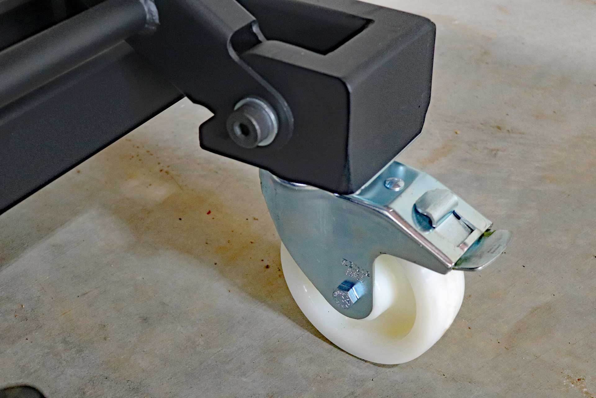 Siegmund Lifting Table A close up of a white wheel on a machine
