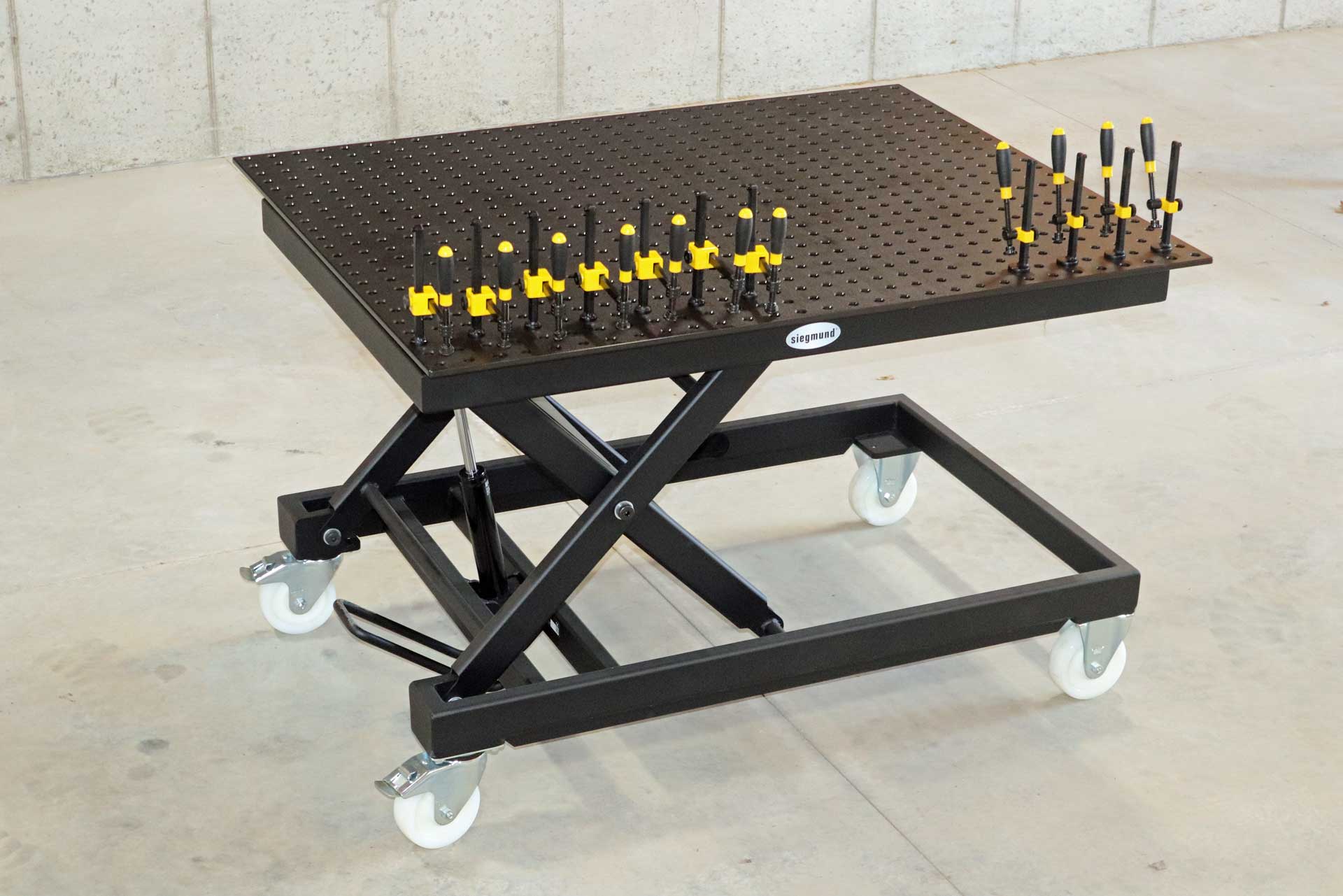 Siegmund Lifting Table A table with a bunch of tools on it