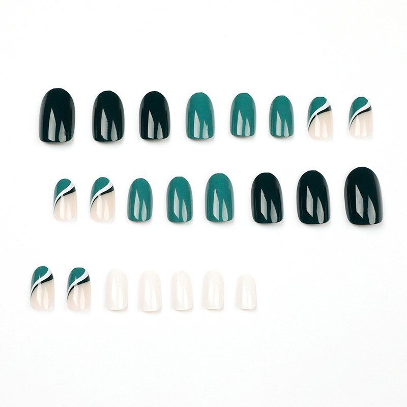 A close up of a woman 's nails with rings on them.
