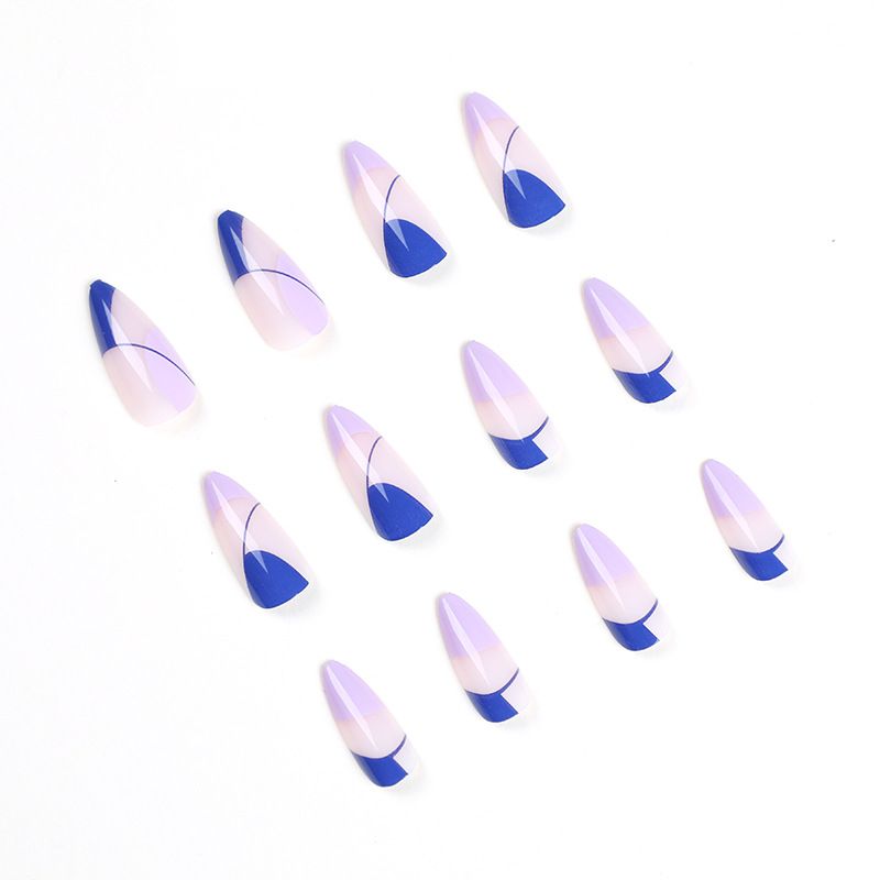 A close up of a person 's nails with rings on them.