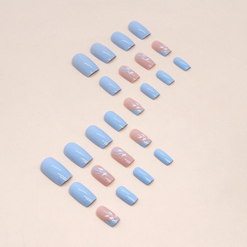 A close up of a woman 's nails with a design on them