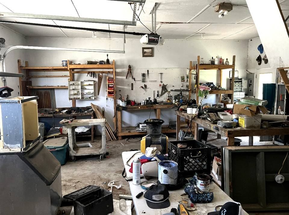 A garage filled with lots of tools and appliances.