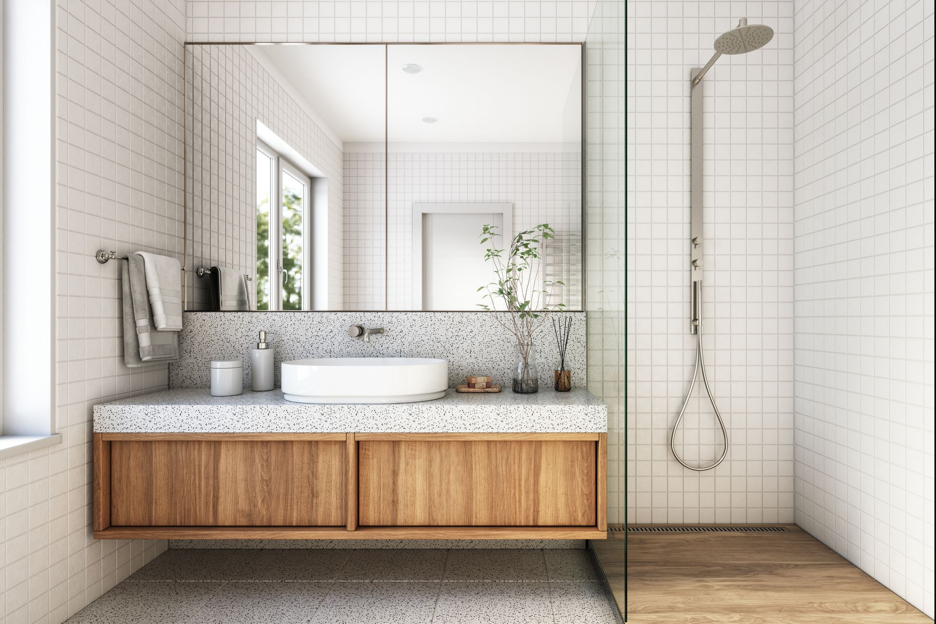 A bathroom with a sink , mirror , and walk in shower.