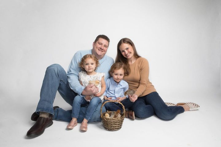 Family Photographer. — Evanston, IL — Bordeaux Studio A family is sitting on the floor posing for a picture. — Evanston, IL — Bordeaux Studio