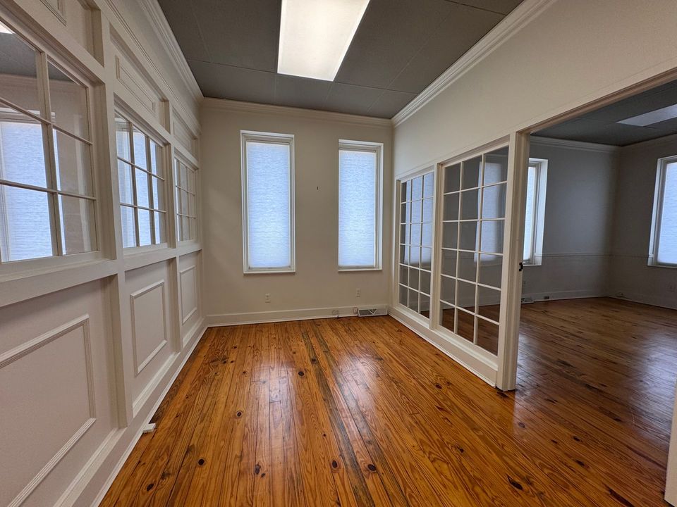 First floor executive suite with hardwood floors and glass French doors at 601 Johnston St SE