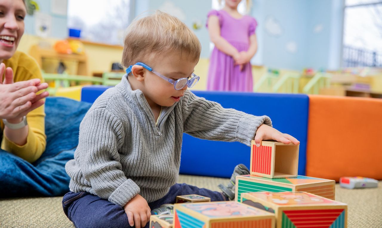 Kid playing bricks.