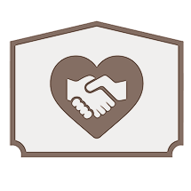 Heart-shaped emblem with handshake reflecting trust and compassion in funeral services.