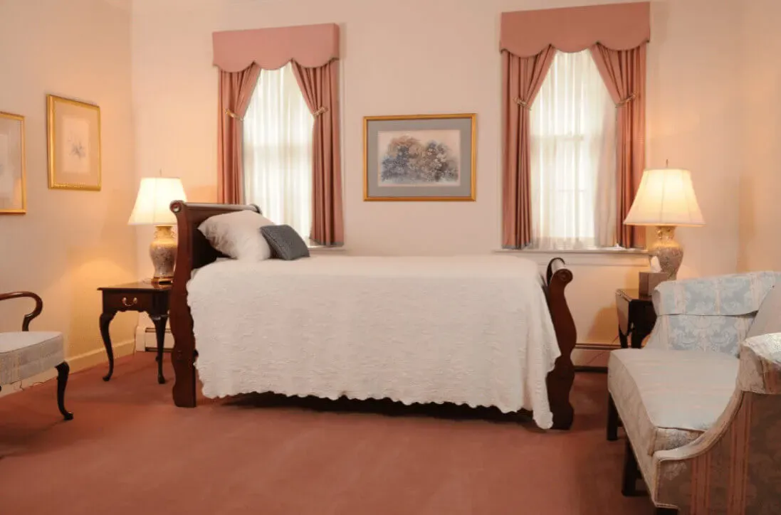 Elegant funeral service room featuring soft lighting, classic decor, and comforting ambiance.