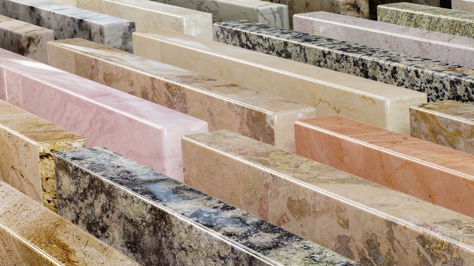 Natural stone countertop samples arranged in rows, showcasing finishes and textures.