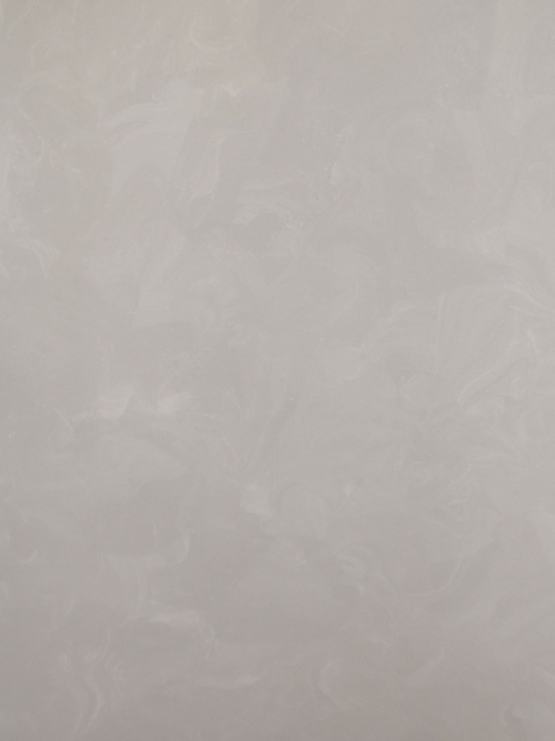 Textured pale gray wall surface.