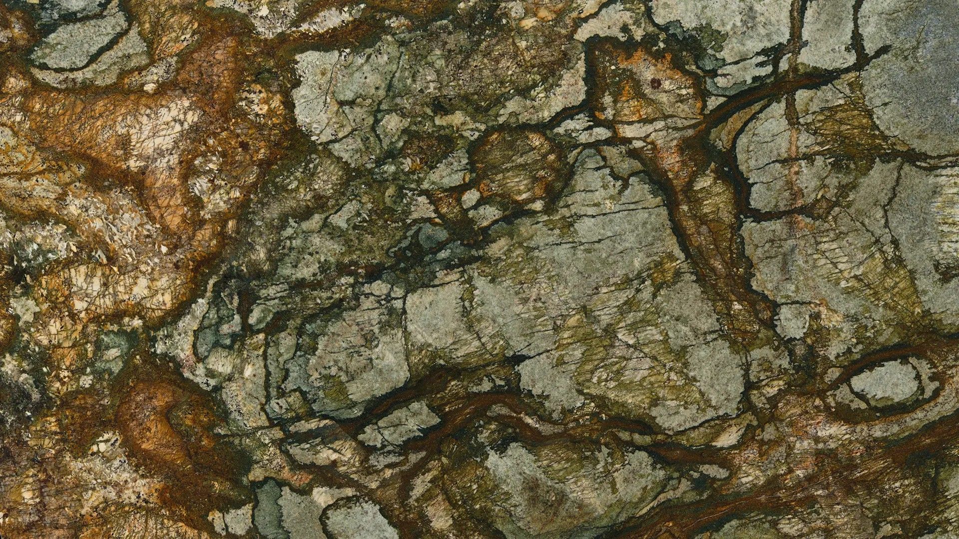 Close-up of cracked gray and brown rock texture with dark veins and rough surface