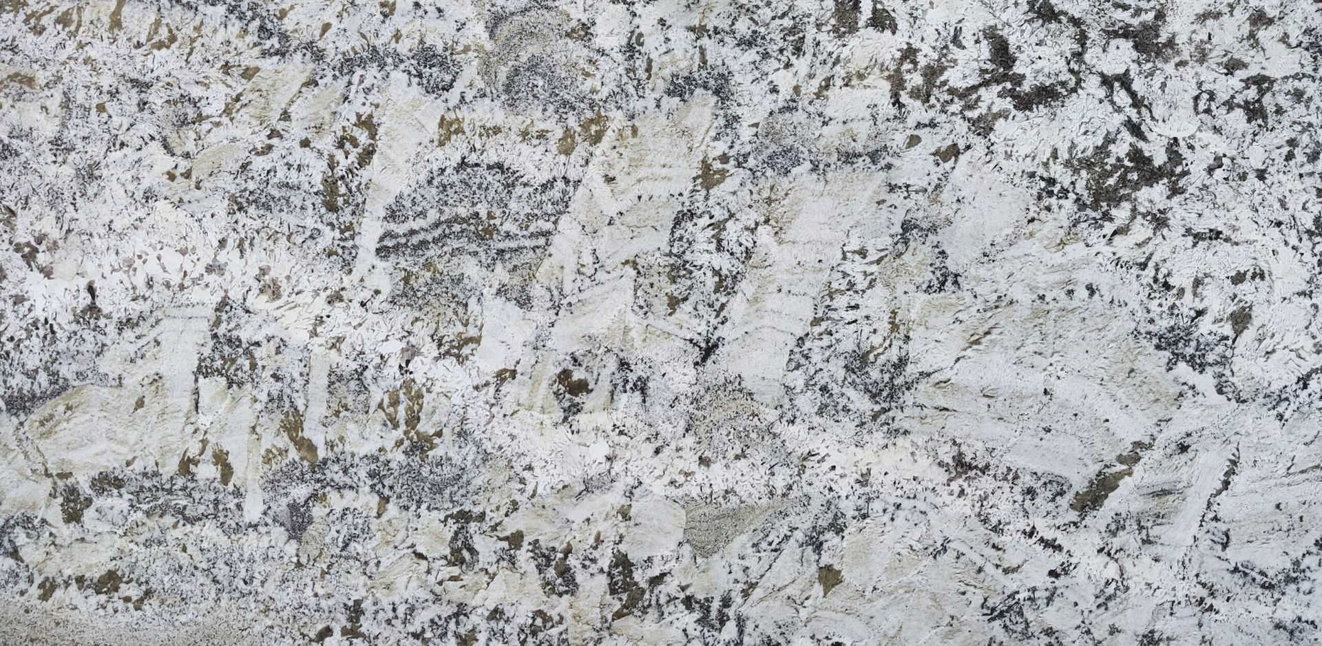 Granite countertop with white, gray, and brown speckled patterns.
