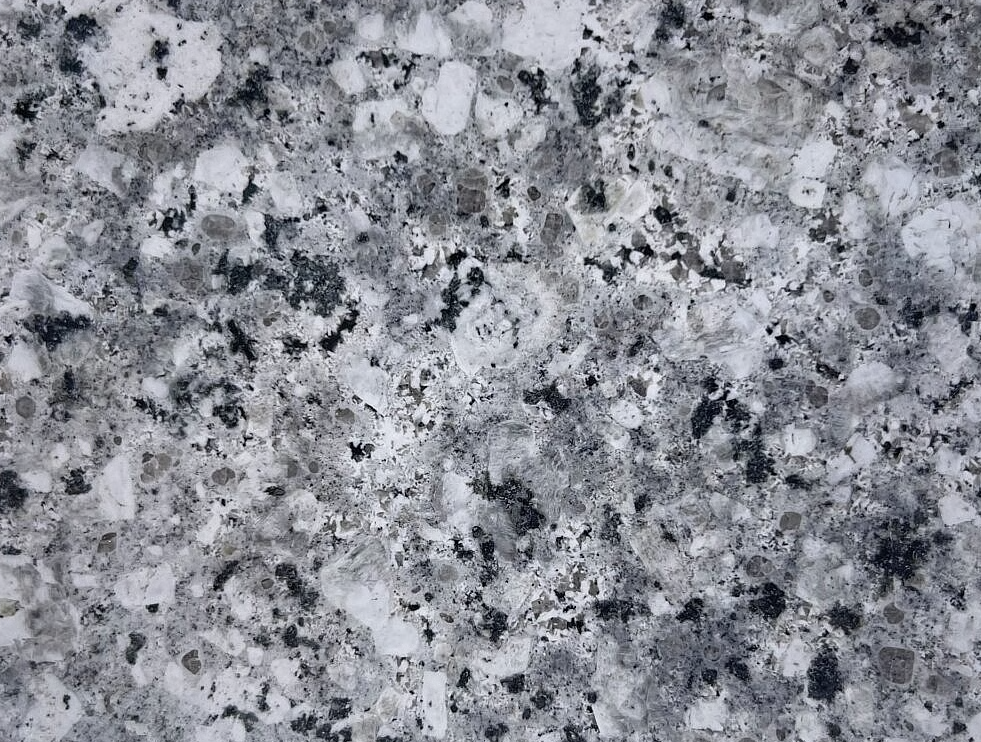 Gray and white granite countertop with black and gray flecks.
