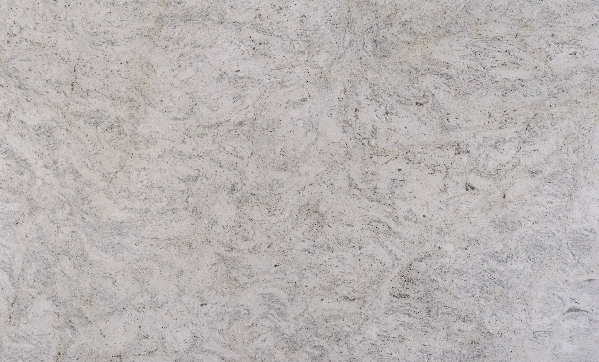 White speckled stone surface with swirling patterns.