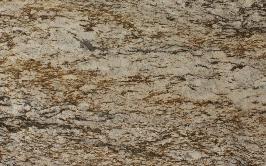 Close-up view of golden granite with brown and black veining, horizontal pattern.