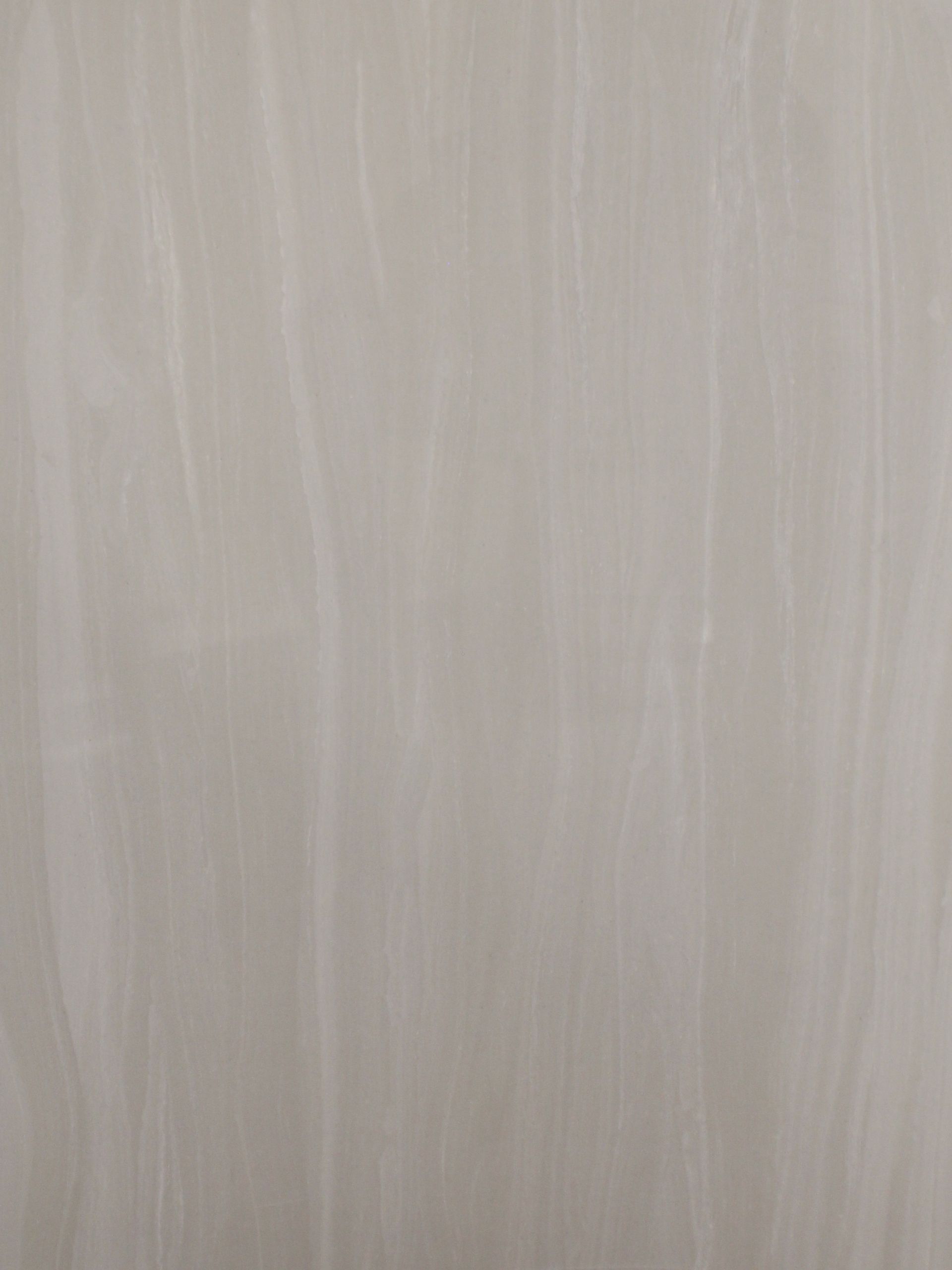 Off-white material with subtle, vertical streaks, resembling a stone or marble surface.