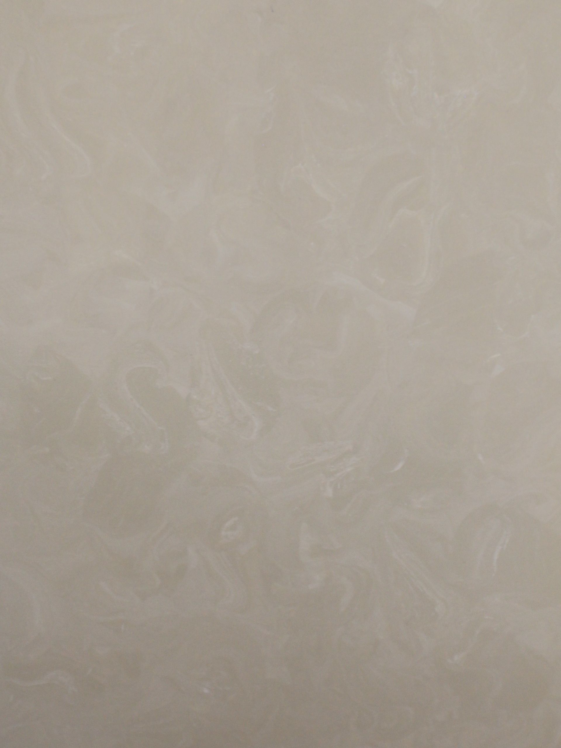 Cream-colored, swirling marble texture.