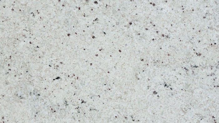 White granite countertop with small black and gray flecks.