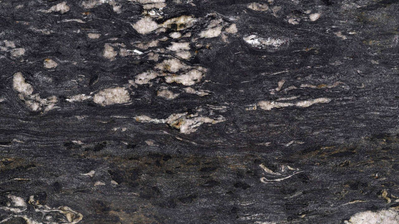 Dark granite with white and beige veins.
