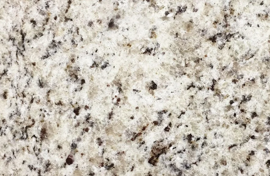 Granite countertop with speckled white, gray, and brown patterns.