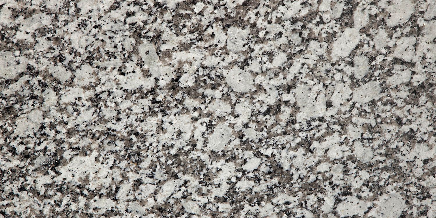 Granite countertop with a speckled pattern in shades of white, gray, and black.