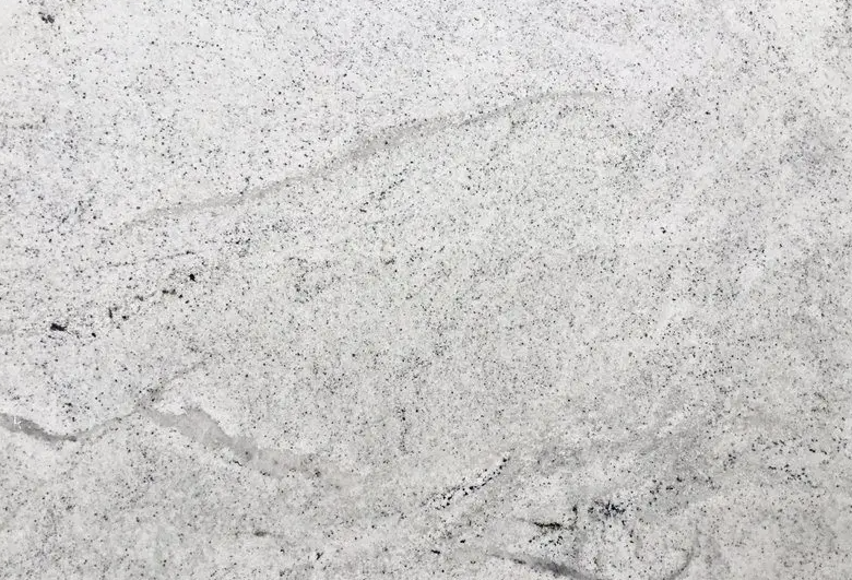 White granite countertop with speckled gray and black flecks.
