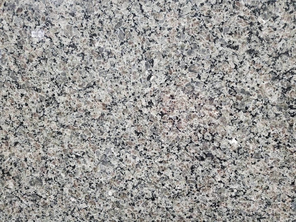 Gray granite countertop with speckled patterns.