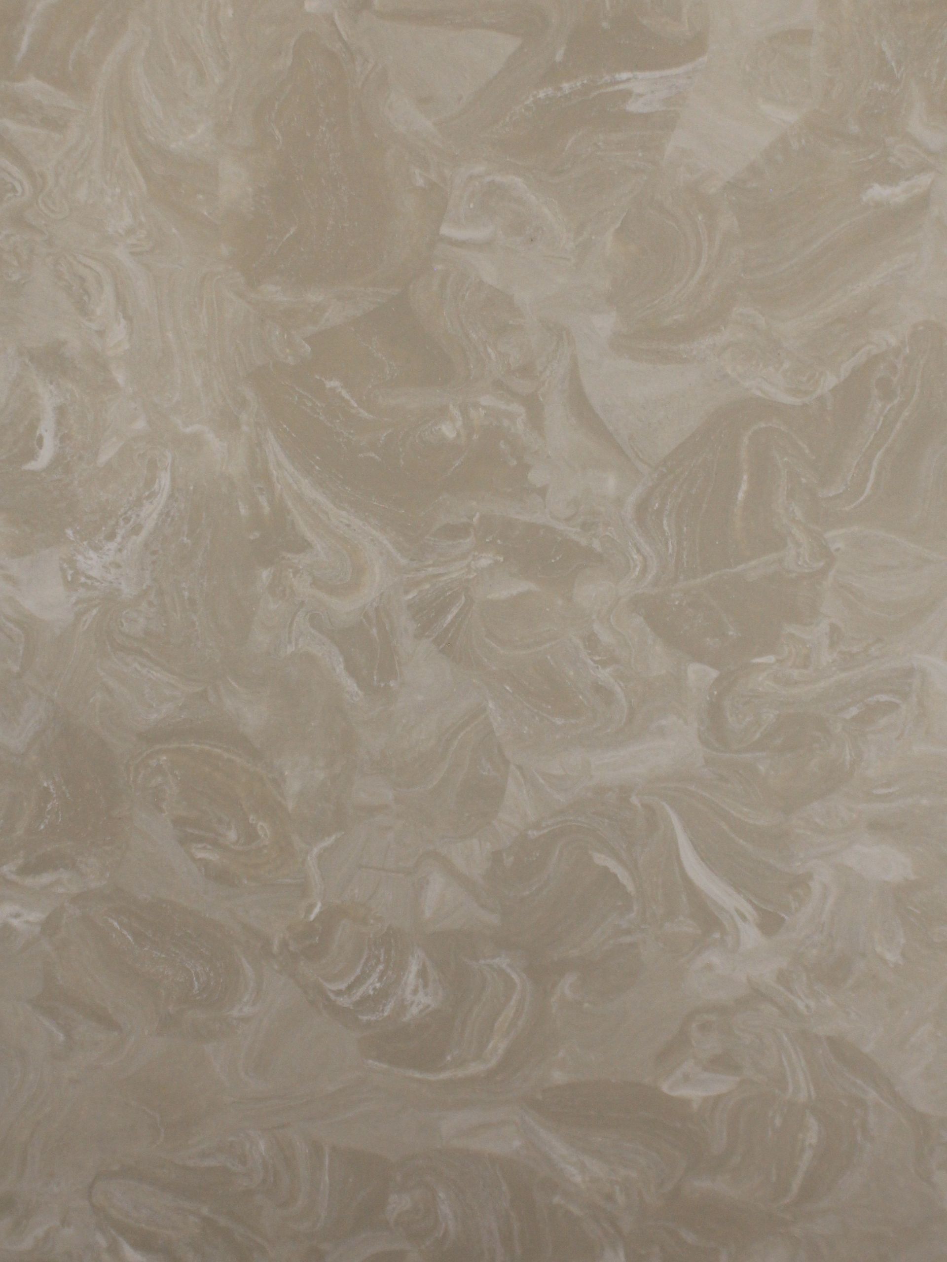Cream-colored surface with swirling, translucent, marbled-like pattern.