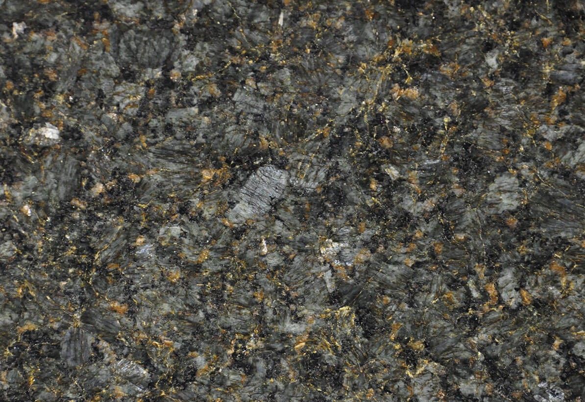 Dark gray speckled granite with golden and black flecks.