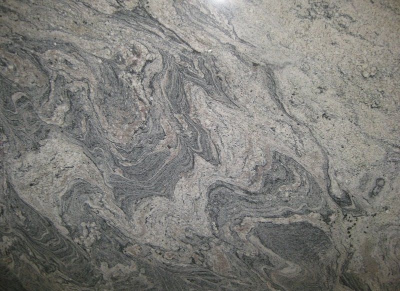 Swirling gray and cream-colored granite countertop with wavy patterns.