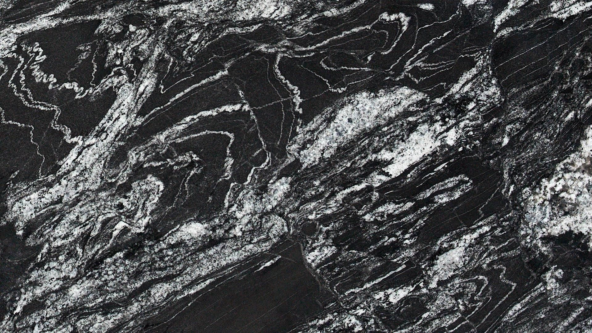 Black and white granite countertop with swirling patterns.