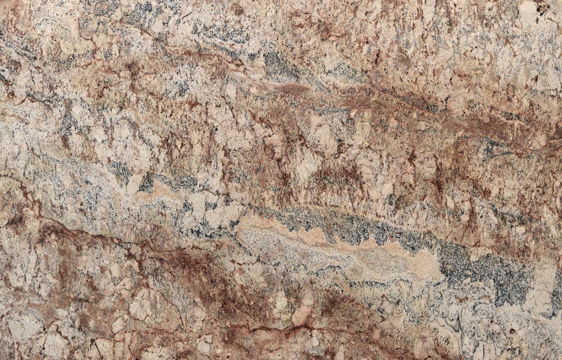 Close-up of a granite countertop with a mix of beige, brown, and gray patterns.