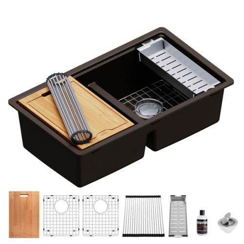 Dark brown kitchen sink with accessories: cutting board, dish rack, and strainer.