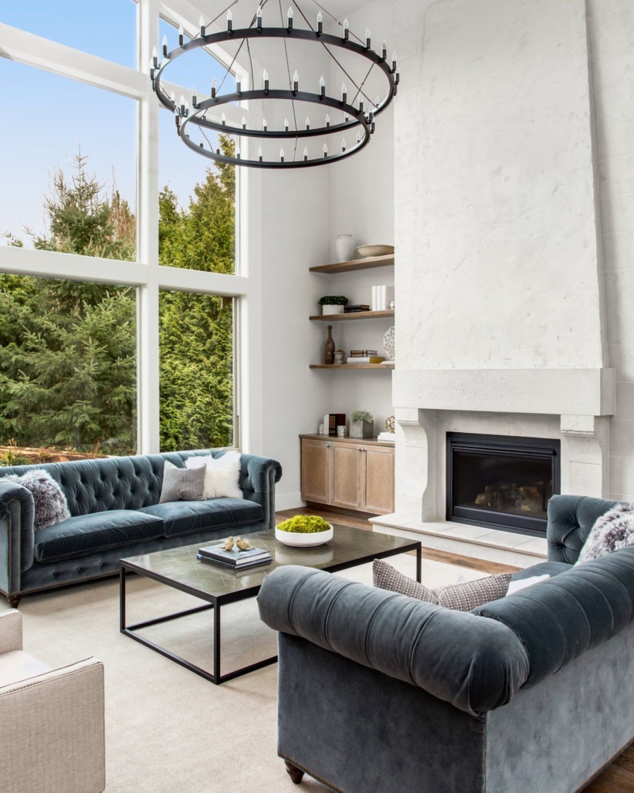 A living room with two couches and a fireplace