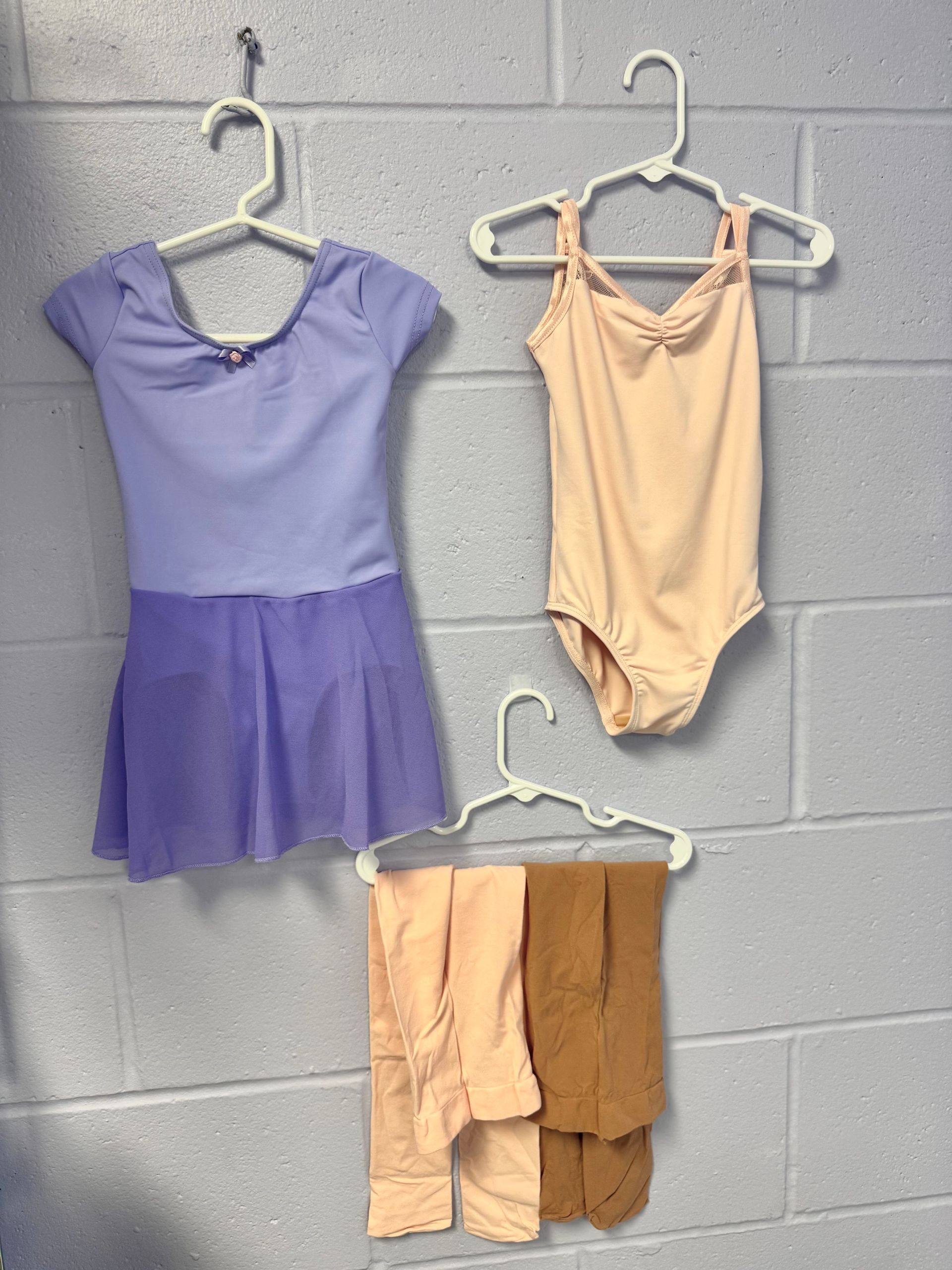 Leotards, dance skirt, and tights sold at Lisa Allen's Dance Works