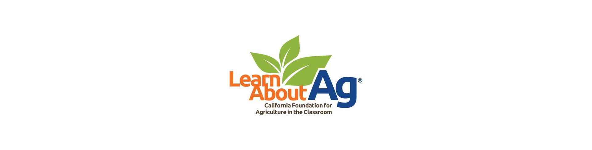 Logo with green leaves, the words 