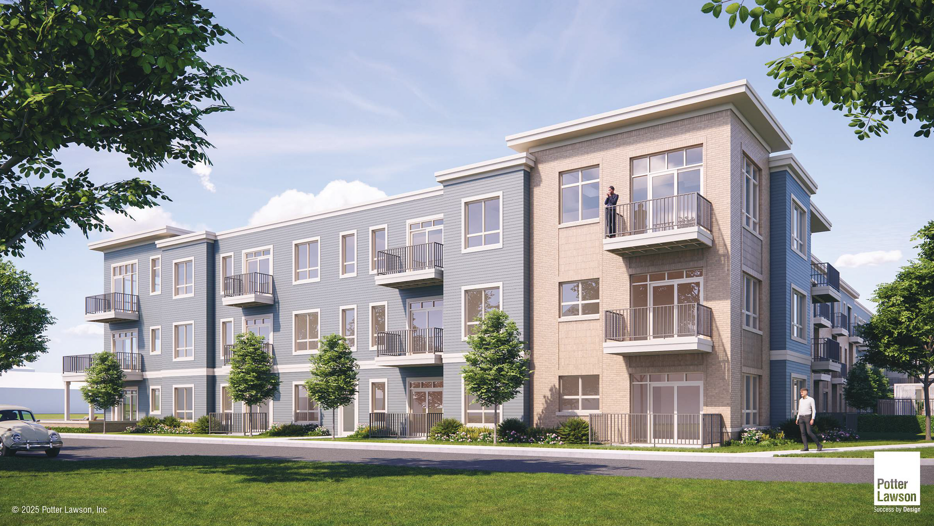 Modern three-story apartment building with gray siding, balconies, and landscaped lawn under a blue sky