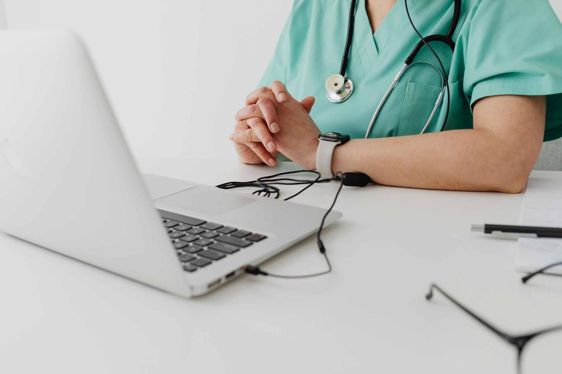 Clipboard with information about telehealth and in-person visits.