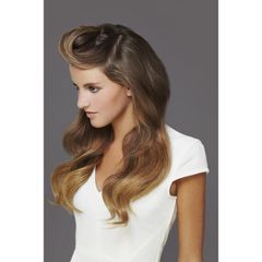 A woman with long hair is wearing a white shirt.