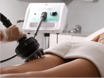 A woman is getting a massage with a machine
